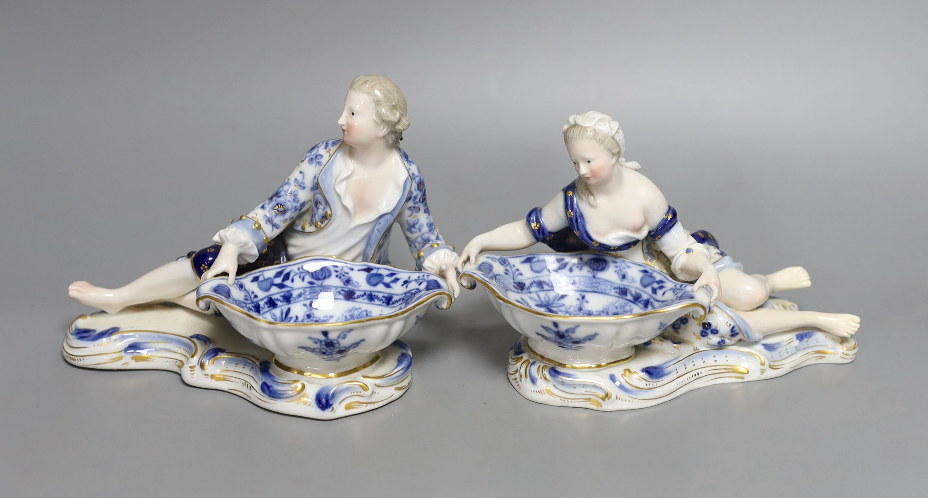 A pair of late 19th century Meissen figural salts, incised numbers ‘2872’ and ‘2873’. 17cm